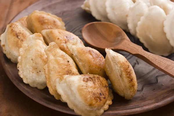 Pierogi fried in the pan until crisp — Stock Photo, Image