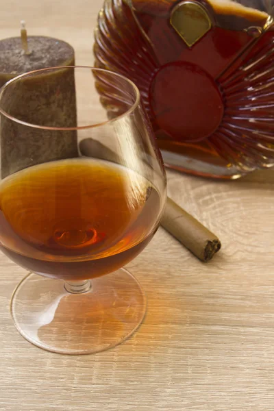 Cognac in glass and cigar — Stock Photo, Image