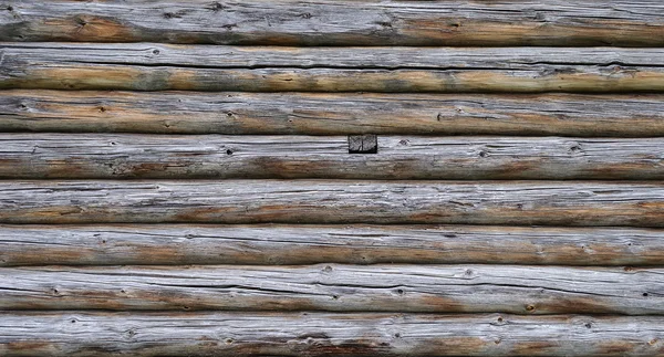 Old weathered log wall — Stock Photo, Image