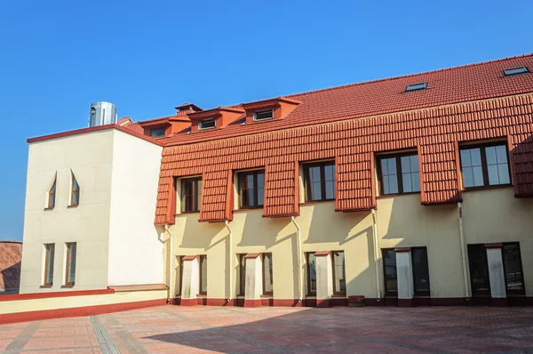 New building with red tiled roof — Stock Photo, Image