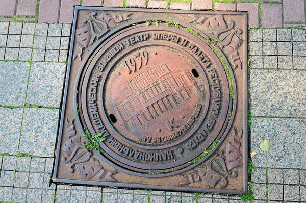 Old soviet sewer manhole cover — Stock Photo, Image
