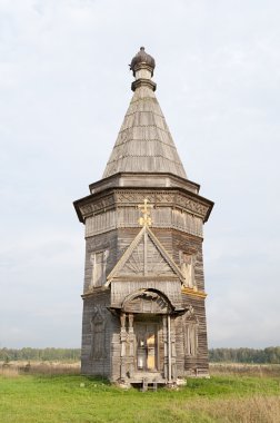 Ancient wooden church in Red Lyaga, Russia clipart