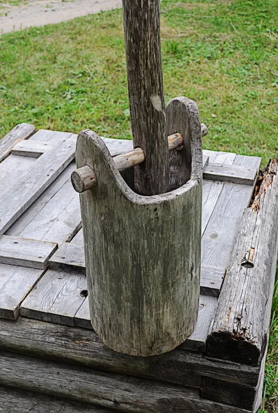 Old wooden bucket on the well — Stock Photo, Image