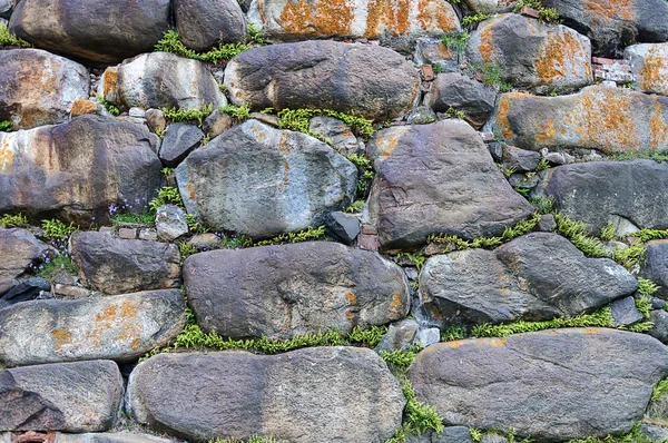 De achtergrond van de muur van de grote rotsblokken — Stockfoto