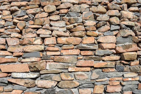 Rough brown stones wall background — Stock Photo, Image