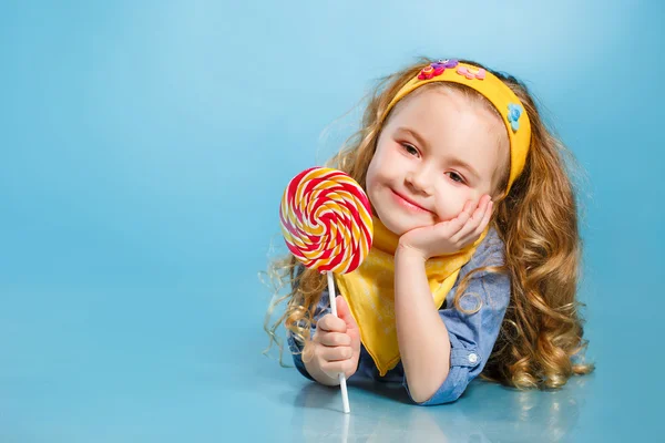 Beautiful little girl with lollipop — Stock Photo, Image