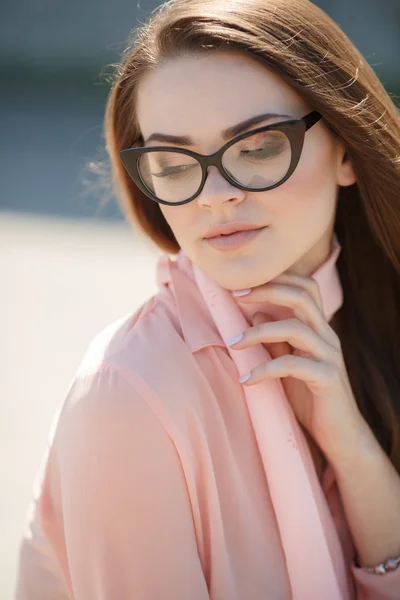 Portrait of a beautiful woman in glasses — Stock Photo, Image