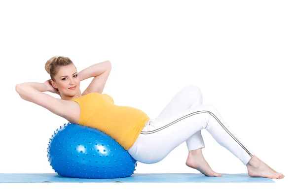A pregnant woman does gymnastics with ball — Stock Photo, Image