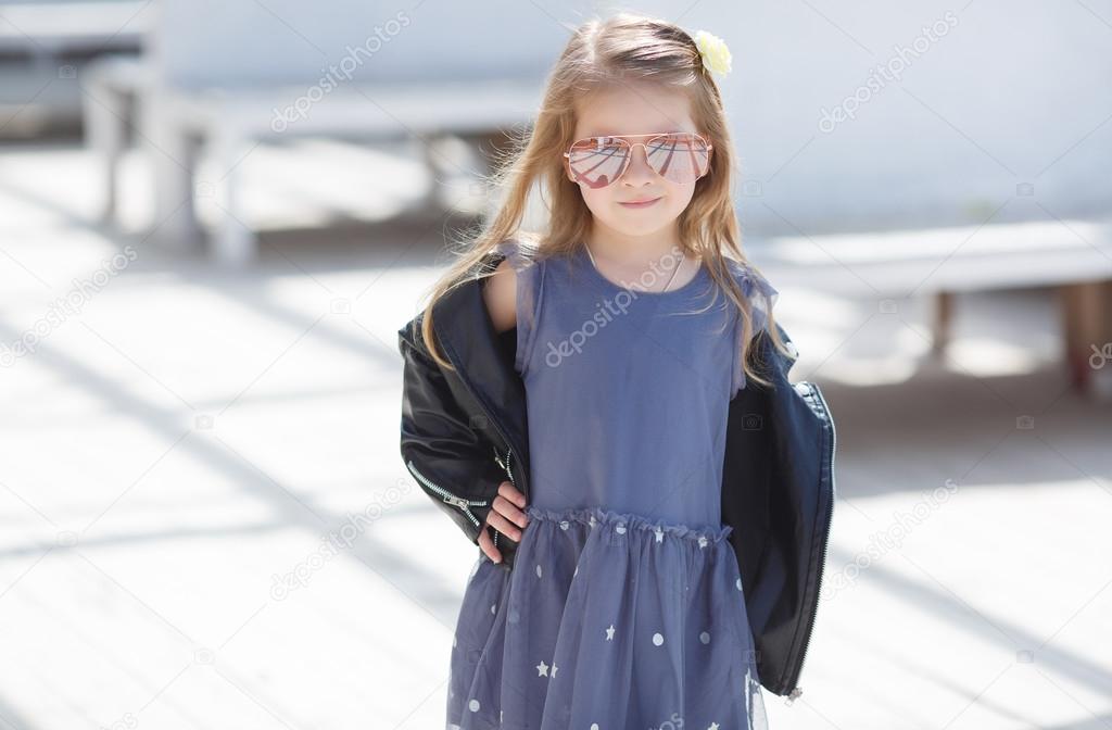 Portrait of an adorable toddler wearing fashion clothes. Stock Photo by ©golyak 107348118