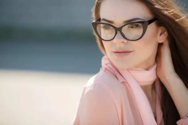 Portrait of a beautiful woman in glasses — Stock Photo, Image