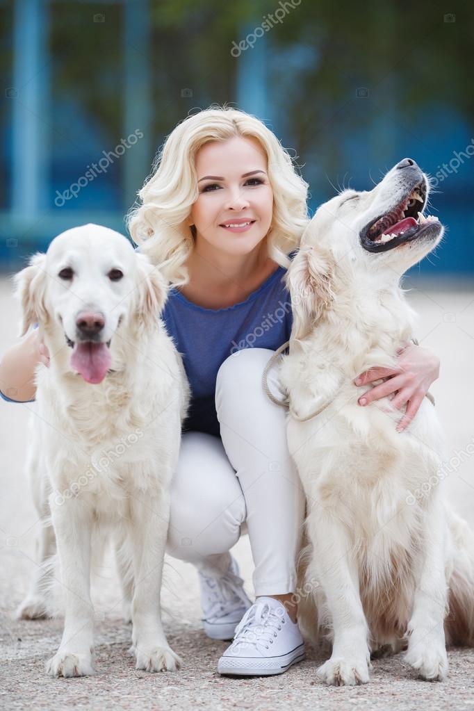 Blonde woman with two golden labrador retrievers outdoor. Stock Photo by ©golyak 110571574 Blonde woman with two golden labrador retrievers outdoor. Stock Photo by ©golyak 110571574