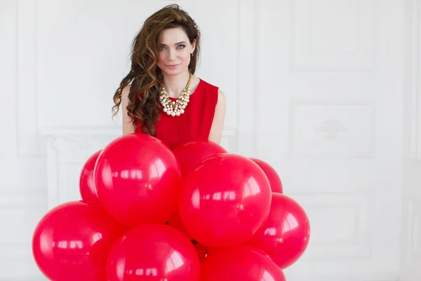 Beautiful woman with balloons. — Stock Photo, Image