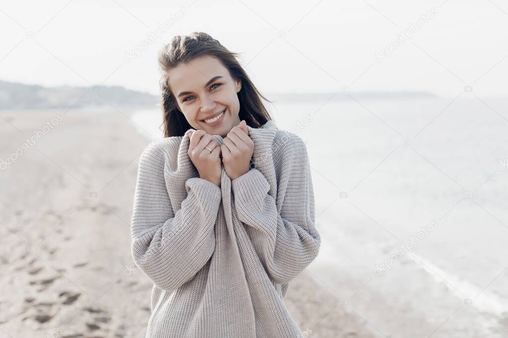 Happy young smiling caucasian woman outdoors