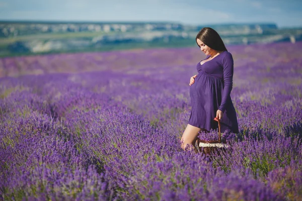 A pregnant woman is enjoying the color Lavender