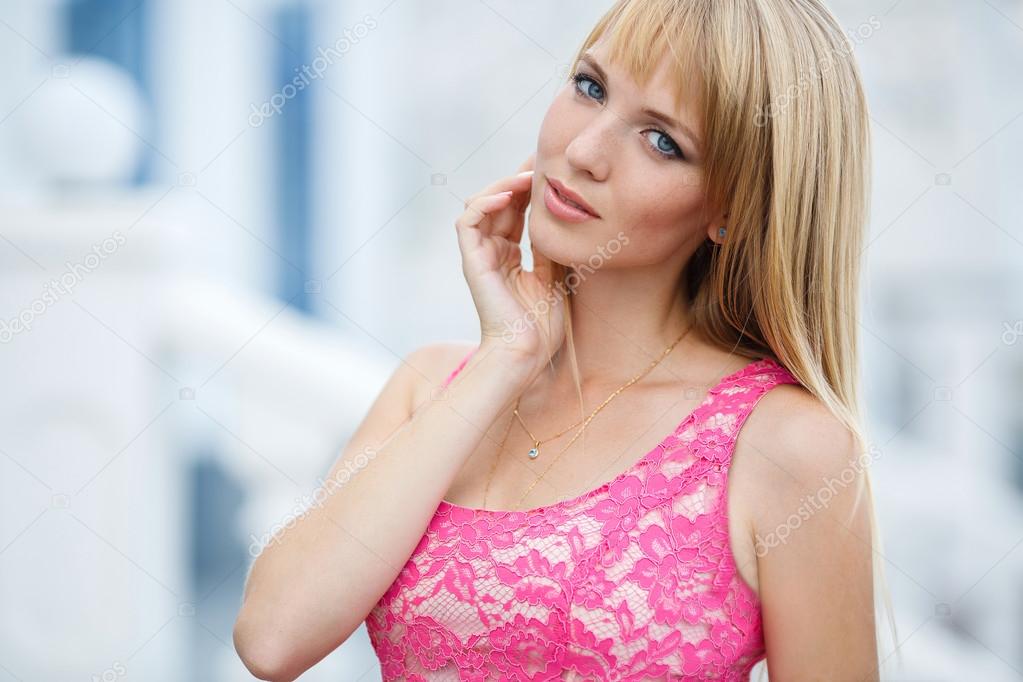 Young smiling woman outdoors portrait.