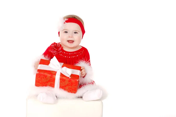 Kleines Mädchen im Weihnachtsmannkostüm. — Stockfoto