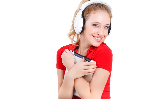 Meisje luisteren naar muziek op een tablet pc. — Stockfoto