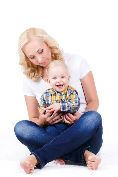 Young mother playing with her little son. — Stock Photo, Image