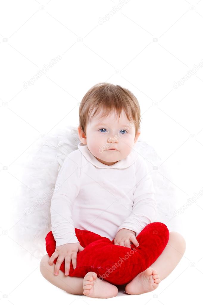 Little angel with red heart isolated on white.
