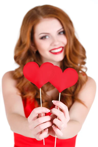 Beautiful girl in a Valentine's Day with a heart on a stick. — Stock Photo, Image