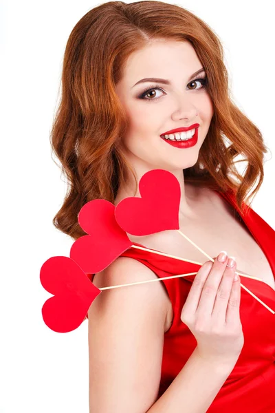Beautiful girl in a Valentine's Day with a heart on a stick. — Stock Photo, Image