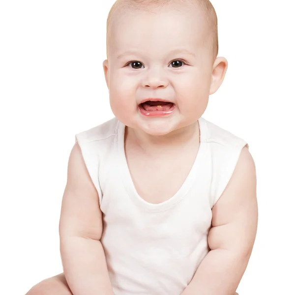 Charming babe is sitting on the bed, on a white background. — Stock Photo, Image