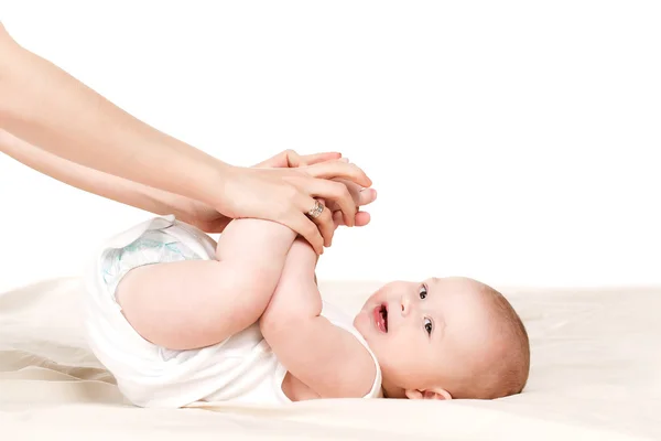 A mother and child play beds in the bedroom. — Stock Photo, Image