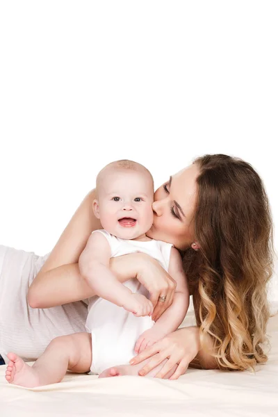 Portrait of happy mother with baby on a white background. — Stock Photo, Image