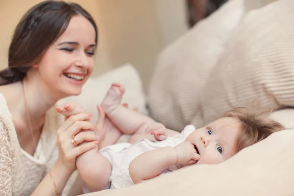 Happy mother playing with child at home — Stok fotoğraf