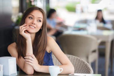 Morning coffee in a cafe for a beautiful woman