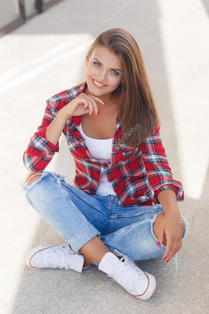 Young smiling woman outdoors portrait