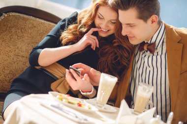 A couple in love in a summer cafe