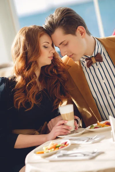 A couple in love in a summer cafe — Stockfoto