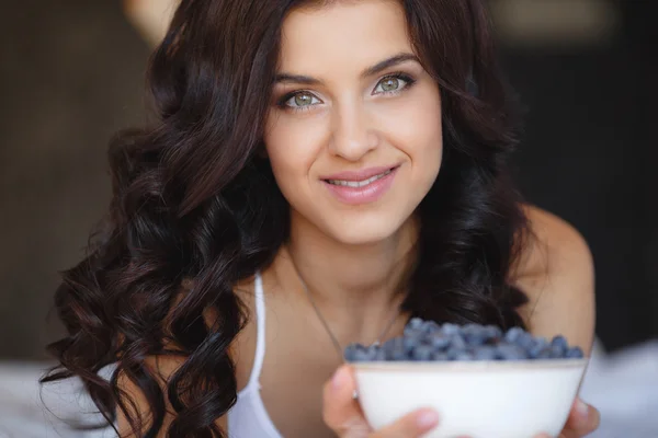 Home portrait of a happy woman with ripe berries — Stock Photo, Image
