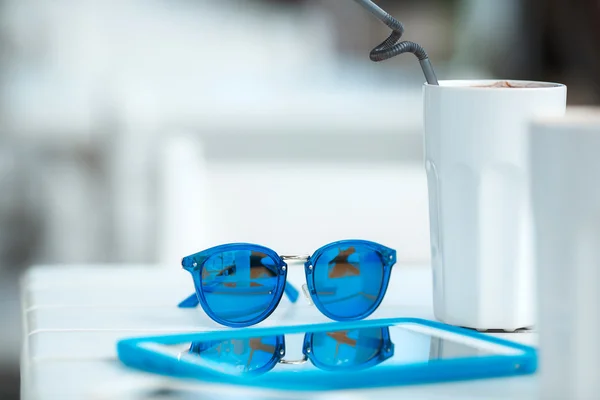 Digital gadget blue glasses and hot coffee — Stock Photo, Image