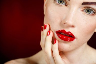 Studio portrait of a redhead female model.