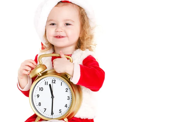 Girl dressed as Santa with a big clock — Stockfoto