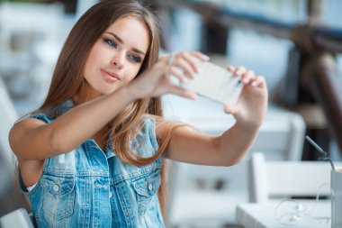 Self-portrait in an outdoor cafe