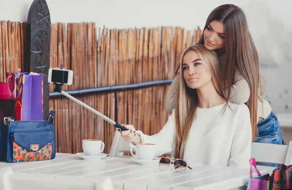 Selfie in a cafe two nice girlfriends. — Stok fotoğraf