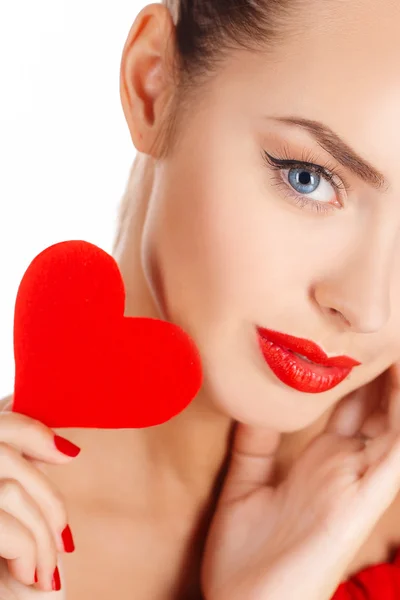 Portrait of a beautiful girl with a red heart in his hand — Stock Photo, Image