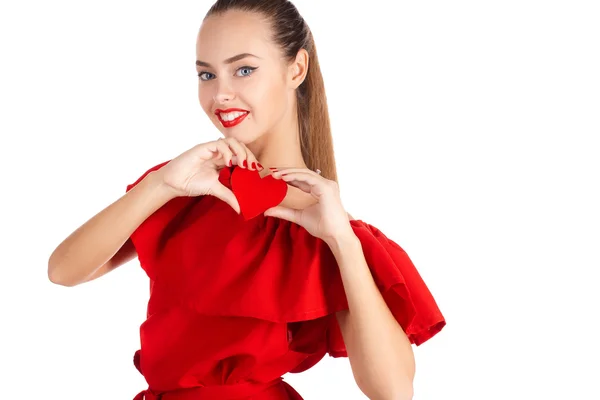 Portrait of a beautiful girl with a red heart in his hand — ストック写真