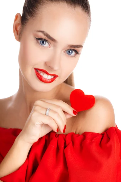 Portrait of a beautiful girl with a red heart in his hand — Stock Photo, Image