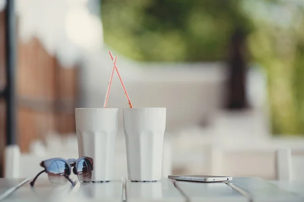 Morning coffee at a table in summer cafe — Stock Photo, Image