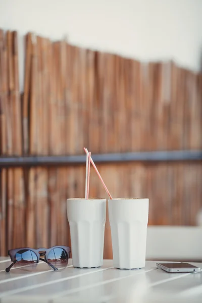 Morning coffee at a table in summer cafe — Stock Photo, Image