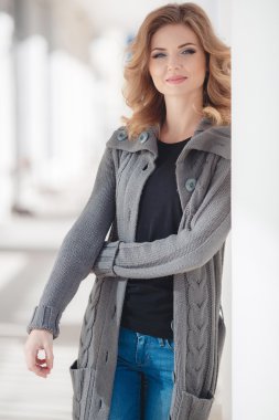 Spring portrait of a beautiful young woman in the city.