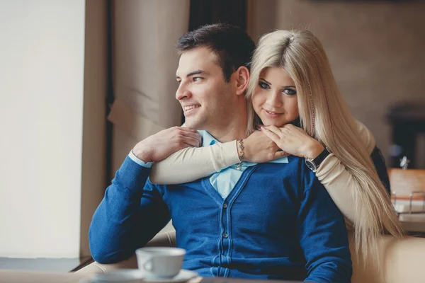 A young couple spends time in a city cafe — 스톡 사진