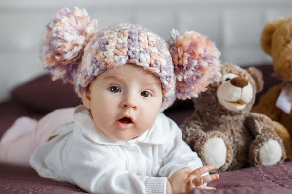 Portrait of a beautiful baby with plush toys — Stok fotoğraf