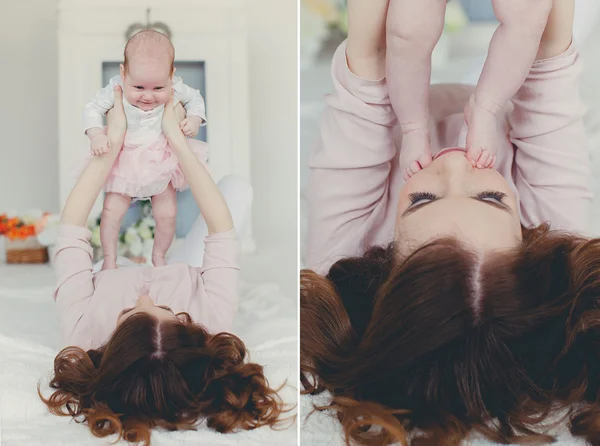 Happy mother holding a newborn child — Stock Photo, Image