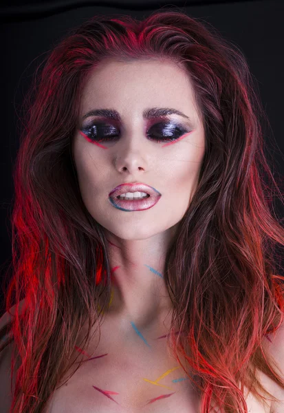 Sensual girl with messy hair and artistic makeup