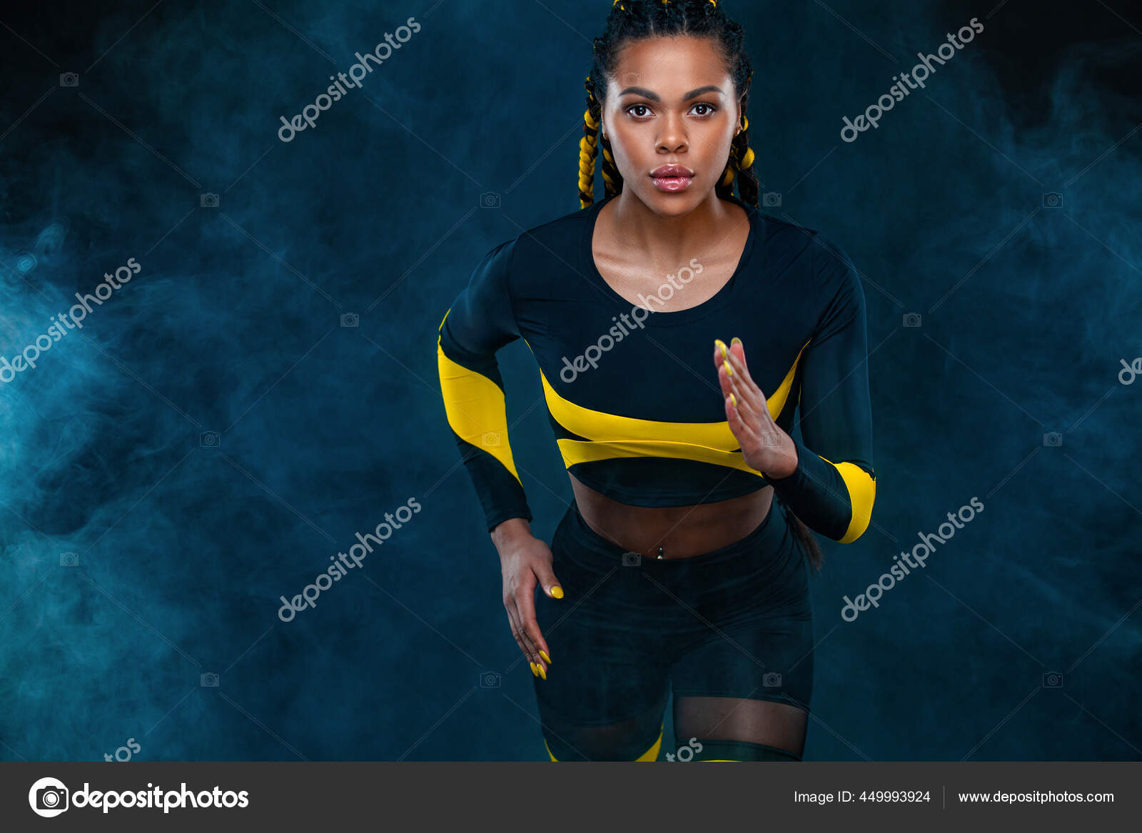 Sprinter run. Strong athletic woman running on black background